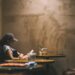 Ilustrasi perempuan yang sedang membaca buku di kafe. (Unsplash/@Bundo Kim)