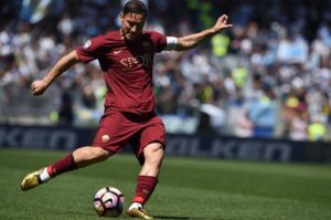 Roma's forward from Italy Francesco Totti kicks the ball during the Italian Serie A football match Roma vs Lazio at the Olympic Stadium in Rome on April 30, 2017. / AFP PHOTO / FILIPPO MONTEFORTE