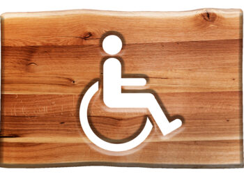 Gambar orang dengan kursi roda, simbol untuk penyandang disabilitas. (Freepik/bedneyimages)